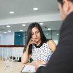 serious thoughtful business lady listening colleagues strateg