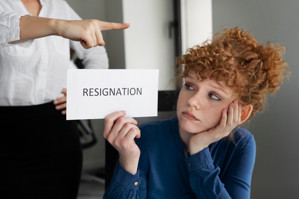 medium shot woman holding resignation note